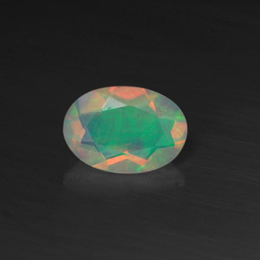 Ópalo multicolor natural de 0,44 ct, corte óvalo, transparente