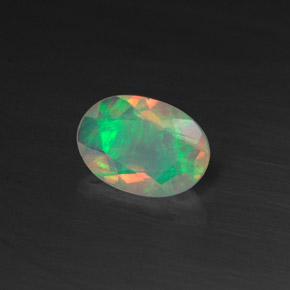 Ópalo multicolor natural de 0,44 ct, corte óvalo, transparente