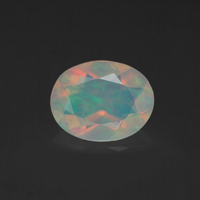 Ópalo multicolor natural de 0,98 ct, corte óvalo, transparente