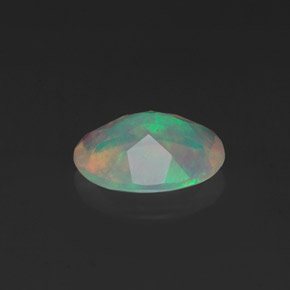 Ópalo multicolor natural de 0,98 ct, corte óvalo, transparente