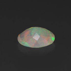 Ópalo multicolor natural de 1,09 ct, corte óvalo, transparente