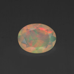 Ópalo multicolor natural de 0,84 ct, corte óvalo, transparente