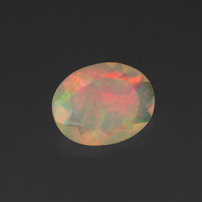 Ópalo multicolor natural de 0,84 ct, corte óvalo, transparente