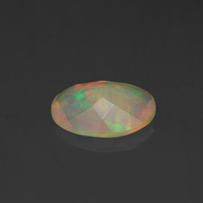Ópalo multicolor natural de 0,84 ct, corte óvalo, transparente