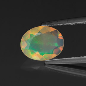 Ópalo multicolor natural de 0,90 ct, corte óvalo, transparente