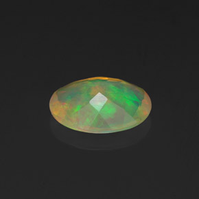 Ópalo multicolor natural de 0,90 ct, corte óvalo, transparente