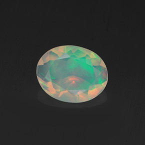 Ópalo multicolor natural de 0,75 ct, corte óvalo, transparente