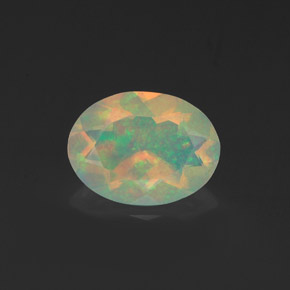 Ópalo multicolor natural de 0,91 ct, corte óvalo, transparente
