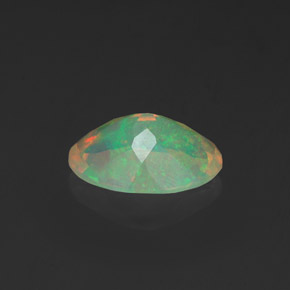 Ópalo multicolor natural de 0,91 ct, corte óvalo, transparente
