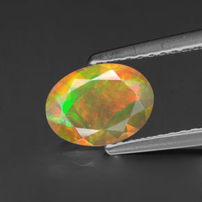 Ópalo multicolor natural de 0,69 ct, corte óvalo, transparente