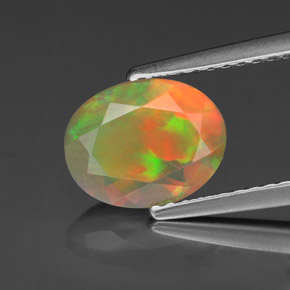 Ópalo multicolor natural de 1,11 ct, corte óvalo, transparente
