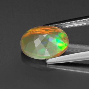 Ópalo multicolor natural de 1,11 ct, corte óvalo, transparente