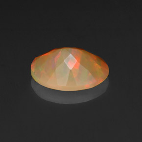 Ópalo multicolor natural de 0,97 ct, corte óvalo, opaco