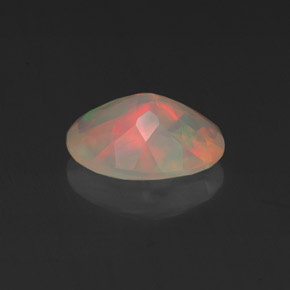 Ópalo multicolor natural de 0,96 ct, corte óvalo, transparente