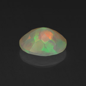 Ópalo multicolor natural de 1,06 ct, corte óvalo, transparente