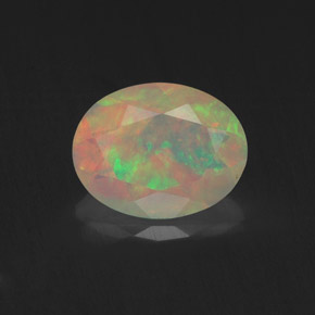 Ópalo multicolor natural de 1,04 ct, corte óvalo, transparente