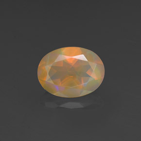 Ópalo multicolor natural de 0,88 ct, corte óvalo, transparente