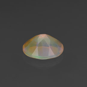 Ópalo multicolor natural de 0,88 ct, corte óvalo, transparente