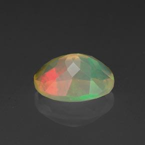 Ópalo multicolor natural de 0,95 ct, corte óvalo, transparente
