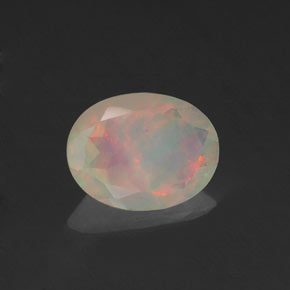 Ópalo multicolor natural de 0,64 ct, corte óvalo, transparente