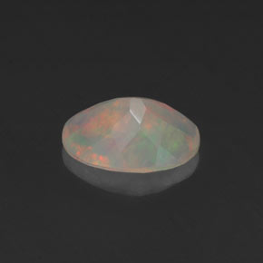 Ópalo multicolor natural de 0,64 ct, corte óvalo, transparente