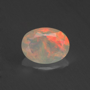 Ópalo multicolor natural de 0,71 ct, corte óvalo, transparente