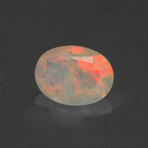 Ópalo multicolor natural de 0,71 ct, corte óvalo, transparente