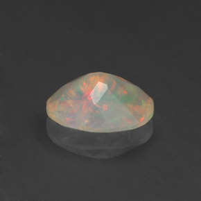 Ópalo multicolor natural de 0,71 ct, corte óvalo, transparente