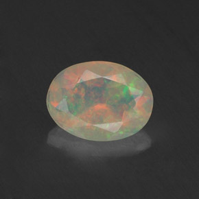 Ópalo multicolor natural de 0,74 ct, corte óvalo, transparente