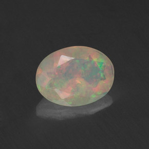 Ópalo multicolor natural de 0,74 ct, corte óvalo, transparente