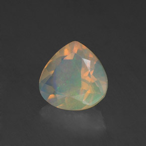 Ópalo multicolor natural de 0,84 ct, en forma de pera, transparente