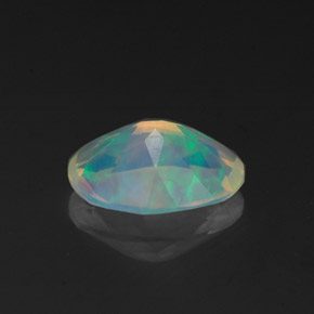 Ópalo multicolor natural de 0,96 ct, corte óvalo, transparente