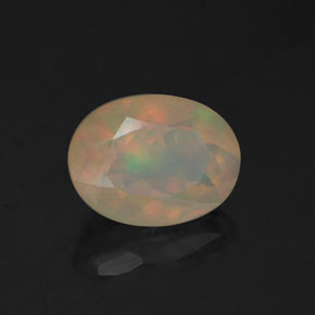 Ópalo multicolor natural de 0,97 ct, corte óvalo, transparente