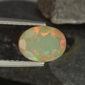 Ópalo multicolor natural de 0,92 ct, corte óvalo, transparente