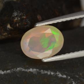 Ópalo multicolor natural de 0,78 ct, corte óvalo, transparente