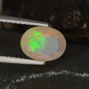 Ópalo multicolor natural de 0,78 ct, corte óvalo, transparente