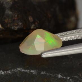 Ópalo multicolor natural de 0,78 ct, corte óvalo, transparente