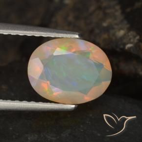 Ópalo Multicolor natural de 1.09 ct, Ovalada, Transparente