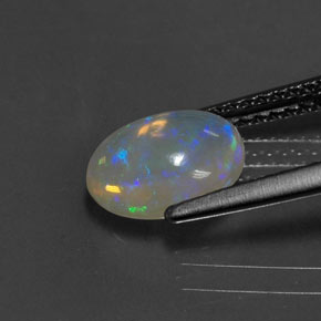 Ópalo multicolor natural de 1,11 ct, corte óvalo, transparente