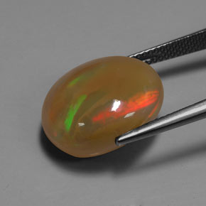 Ópalo multicolor natural de 9,93 ct, corte óvalo, translúcido