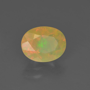 Ópalo multicolor natural de 0,85 ct, corte óvalo, transparente