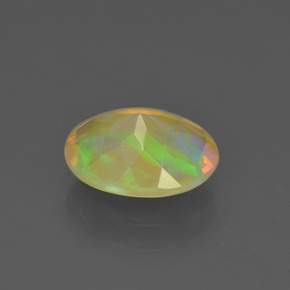 Ópalo multicolor natural de 0,93 ct, corte óvalo, transparente