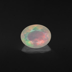 Ópalo multicolor natural de 0,98 ct, corte óvalo, transparente