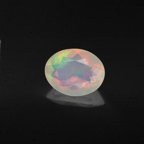 Ópalo multicolor natural de 0,98 ct, corte óvalo, transparente