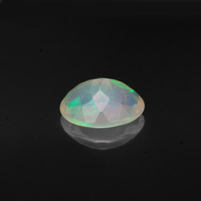 Ópalo multicolor natural de 0,98 ct, corte óvalo, transparente