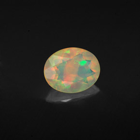 Ópalo multicolor natural de 0,92 ct, corte óvalo, transparente