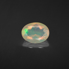 Ópalo multicolor natural de 1,10 ct, corte óvalo, transparente