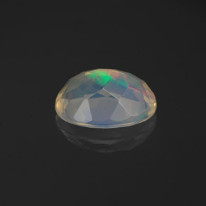 Ópalo multicolor natural de 1,06 ct, corte óvalo, transparente