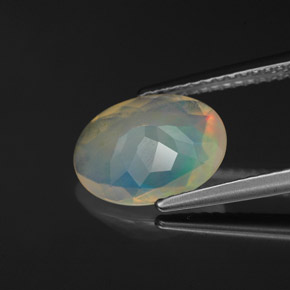 Ópalo multicolor natural de 1,53 ct, corte óvalo, transparente