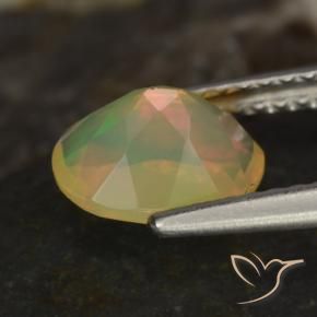 Ópalo Multicolor natural de 0.83 ct, Ovalada, Transparente